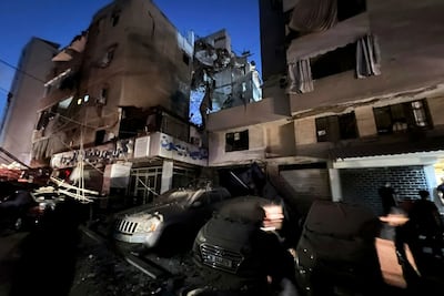 People inspect damaged cars in the southern suburbs of Beirut, Lebanon, Tuesday, July 30, 2024. AP Photo