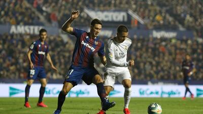 Eden Hazard of Real Madrid is challenged by Nikola Vukcevic of Levante. Getty Images