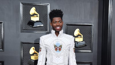 Lil Nas X, wearing an embellished suit, at the Grammy Awards on April 3, 2022. AFP