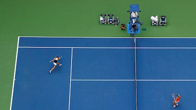 Karolina Pliskova, left, returns a shot to Angelique Kerber. Al Bello / Getty Images