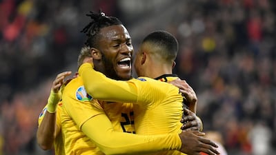 Belgium's Youri Tielemans, right, celebrates with Belgium's Michy Batshuayi, left, after scoring his sides first goal. AP Photo