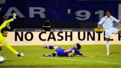 England's Theo Walcott drives home his second goal past the Croatian keeper Stipe Pletikosa's despairing dive.