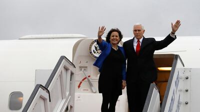 U.S. Vice President Mike Pence and his wife Karen wave as they board an airplane ahead of their departure from Ben Gurion International Airport, in Lod, near Tel Aviv, Israel, Tuesday, Jan. 23, 2018. (Ronen Zvulun/Pool photo via AP)