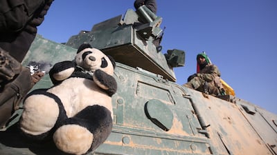 Iraqi Shiite fighters from the Hashed Al Shaabi paramilitaries advance in a desert area near the village of Tall Abtah, south-west of Mosul, on November 28, 2016, during a broad offensive by Iraq forces to retake Mosul from ISIS.