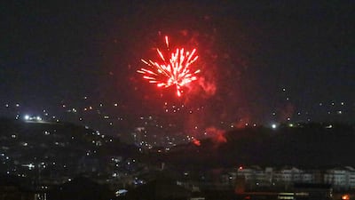 Celebratory gunfire light up part of the night sky after the last US aircraft took off from the airport in Kabul early on August 31, 2021. AFP