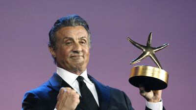 American actor and director Sylvester Stallone poses with his Career Achievement Award at the El Gouna film festival on the Red Sea in Egypt. AFP