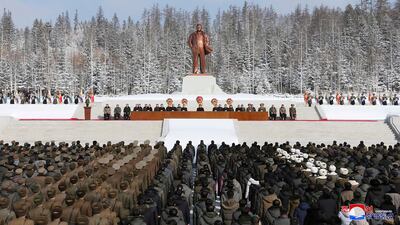 North Korean leader Kim Jong Un (C) attending a national meeting to celebrate the 80th anniversary of the birth of chairman Kim Jong Il, in front of his statue in Samjiyon City, North Korea. AFP