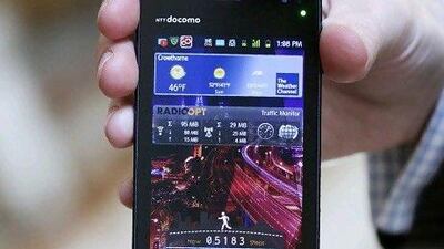 A water-resistant Fujitsu Apollo smartphone gets a dip during a demonstration at the World Mobile Forum in Spain this year. Chris Ratcliffe / Bloomberg News