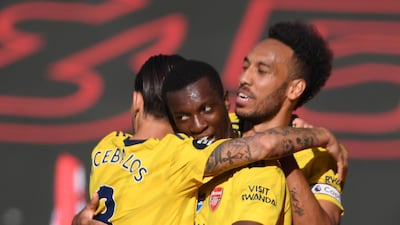 Arsenal striker Eddie Nketiah celebrates with teammates. AFP