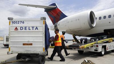 A Delta Air Lines flight at Baltimore-Washington International Thurgood Marshall Airpor. The US federal department of Ttansportation reported that US airlines are improving on-time arrivals and cancelling fewer flights. Patrick Semansky / AP