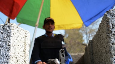 A Pakistani security official stands guard at a checkpoint in Islamabad. EPA