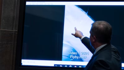 Deputy Director of Naval Intelligence Scott Bray points to a video display of an unexplained aerial phenomenon during a 2022 hearing. AP