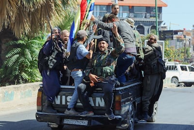 Syrian Druze fighters roam the streets of Sweida after the withdrawal of government troops. AFP