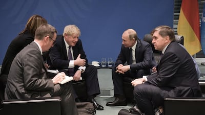 Britain's Prime Minister Boris Johnson and Russian President Vladimir Putin meet on the sidelides of a Peace summit on Libya in Berlin. AFP