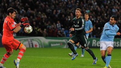 Manchester City striker Carlos Teves has his shot saved by Real Madrid goalkeeper Iker Casillas