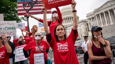 Activists join Senate Democrats outside the Capitol, in Washington, to demand action on gun control legislation after the killings at the Texas elementary school this week. AP