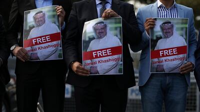Holding pictures of missing Saudi writer Jamal Khashoggi, people gather in his support, near the Saudi Arabia consulate in Istanbul. AP