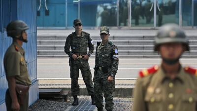 South Korean soldiers inspect and their North Korean counterparts during a reunification rally in the border village of Panmunjom at the DMZ in North Korea, in 2015.