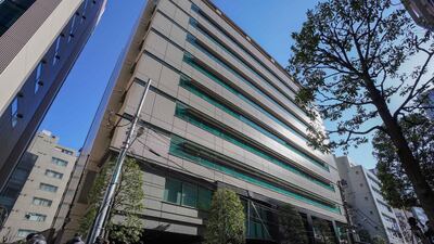Journalists gather in front of Coincheck's offices in Tokyo. Regulators are set to fine the company after $534 million worth of coins were lost to hackers. Christopher Jue / EPA