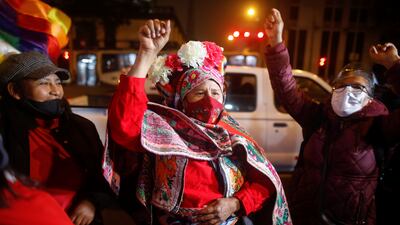 Supporters of leftist Pedro Castillo react outside the headquarters of the "Free Peru" party after Peru's electoral authority announced him as the winner of the presidential election, in Lima.