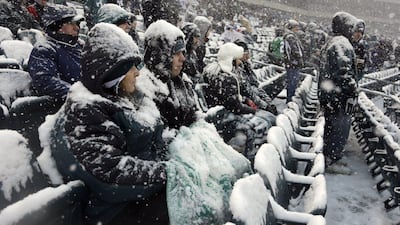Fans in Philadelphia, Pennsylvania battle the cold on Sunday. Matt Rourke / AP