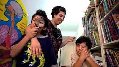 Seema Zaman plays with her sons Arsalaan, 8, and Armaan, 4, in their home in Abu Dhabi. Silvia Razgova / The National
