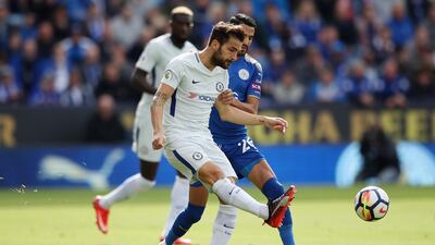 Chelsea midfielder Cesc Fabregas in action against Leicester City winger Riyad Mahrez. Clive Mason / Getty Images