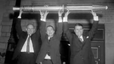 Holding up the dream: (Left-right) Dr William Pickering, Dr. James Van Allen and Dr. Wernher Von Braun cheer the launch of the first US satellite.