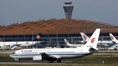 Air China passenger jets and a Lufthansa aircraft are seen at Terminal Three of Beijing Capital International Airport. The two carriers have signed agreement designed to boost earnings. Petar Kujundzic / Reuters