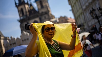 Sheltering from the heat on a sunny day at Old Town Square in Prague, Czech Republic, where a new national temperature record of 40.9°C was set on June 27. EPA