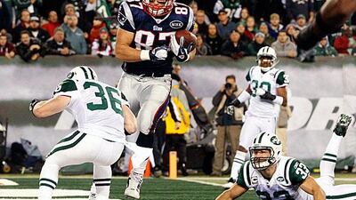 Rob Gronkowski, the New England tight end, catches a touchdown pass during the Patriots 371-6 rout of the New York Jets.