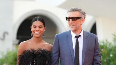 Vincent Cassel and his wife, Tina Kunakey, arrive for the screening of 'J'Accuse' on August 30, 2019 during the Venice Film Festival. AFP