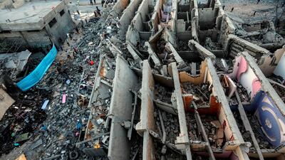 A picture taken shows the remains of a building in Gaza City after it was hit during Israeli air strikes. AFP