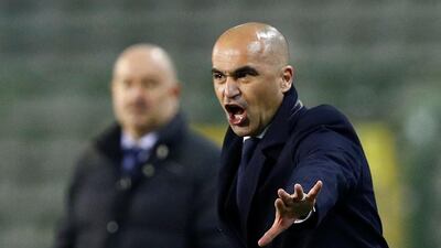 Belgium coach Roberto Martinez as Russia coach Stanislav Cherchesov looks on. Reuters
