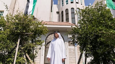 Mohammed Noor Al Khoori has been putting up the flag at his house in Abu Dhabi every year after the UAE's union. Reem Mohammed / The National