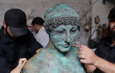 A 2,500-year-old bronze statue of the Greek god Apollo discovered by a Palestinian fisherman. Alamy Stock Photo