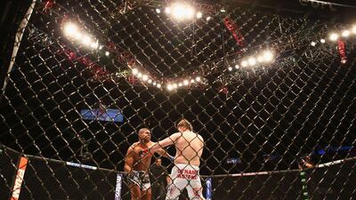 Alistair Overeem, left, fights with Roy Nelson in their heavyweight bout on Saturday at UFC 185. Ronald Martinez / Getty Images / AFP