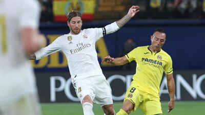 Real Madrid's Sergio Ramos, left, vies for the ball with Villareal's Santi Cazorla during the Spanish La Liga soccer match between Villarreal and Real Madrid in the Ceramica stadium in Villarreal, Spain. AP