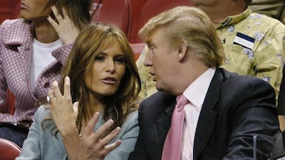 Donald Trump and Melania Knauss, in a blazer, attend a game between Miami Heat and the Denver Nuggets at the American Airlines Arena in Miami, US, on December 17, 2004. EPA