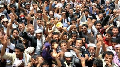 Yemeni anti-government protesters shout slogans demanding the immediate creation of a governing council to lead the country, in Sana'a yesterday. YAHYA ARHAB / EPA