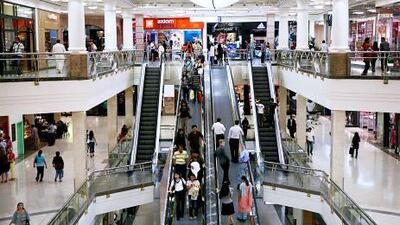 Shoppers such as these at Deira City Centre in Dubai view malls as a source of entertainment and socialising.