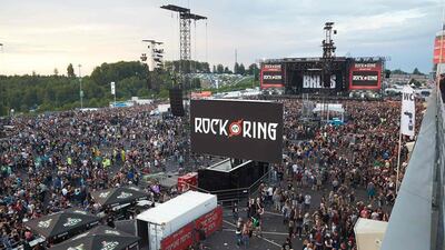 Festival goers leave the venue of the Rock am Ring music festival in Nuerburg on June 2, 2017 following an evacuation alert over a possible terrorist threat. Thomas Frey / dpa / AFP