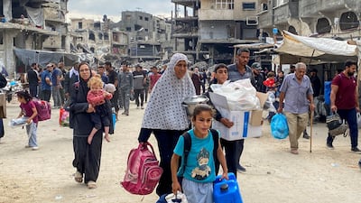 Palestinians flee Israeli air strikes on Jabilia in the north of the Gaza Strip on Sunday with all they can carry. Reuters