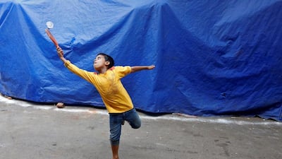 A young boy plays badminton in a slum area of Kolkata. Rupak De Chowdhuri / Reuters