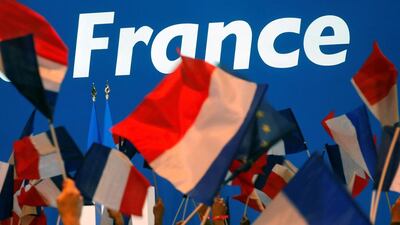 Supporters of Emmanuel Macron wait for his arrival at the Parc des Expositions hall in Paris. Philippe Wojazer / Reuters