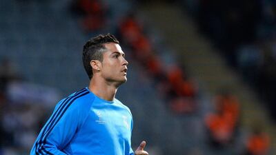 Real Madrid's Cristiano Ronaldo warms up before the Champions League match against Malmo on Wednesday night. Jonathan Nackstrand / AFP