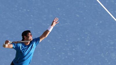 Tunisian Malek Jaziri serves to Russian Mikhail Youzhny during their ATP tennis match on the first round of the Dubai Duty Free Tennis Championships on February 22, 2016. AFP / KARIM SAHIB