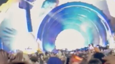 Fans attending a performance by rapper Travis Scott shout to others to make space. AP