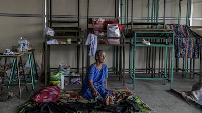 People from flood-stricken villages take shelter at a relief camp at a college in Chengannur, Kerala. Getty Images