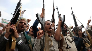 Houthi supporters shout slogans and hold up their weapons in Sanaa, Yemen, in August. EPA